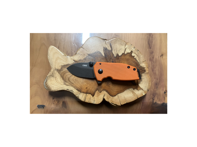 CRKT Squid Compact Orange coltello pieghevole compatto con lama D2, apertura assistita e manico G10 arancione ad alta visibilità.